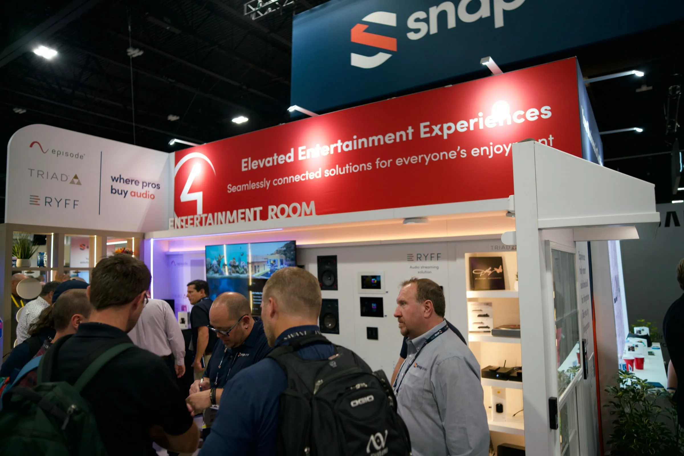 Entertainment room with a red "Elevated Entertainment Experiences" header