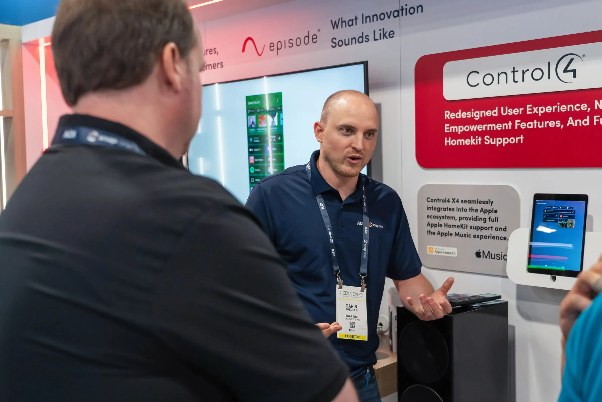 Snap One staff member presenting at the Control4 and Episode wall