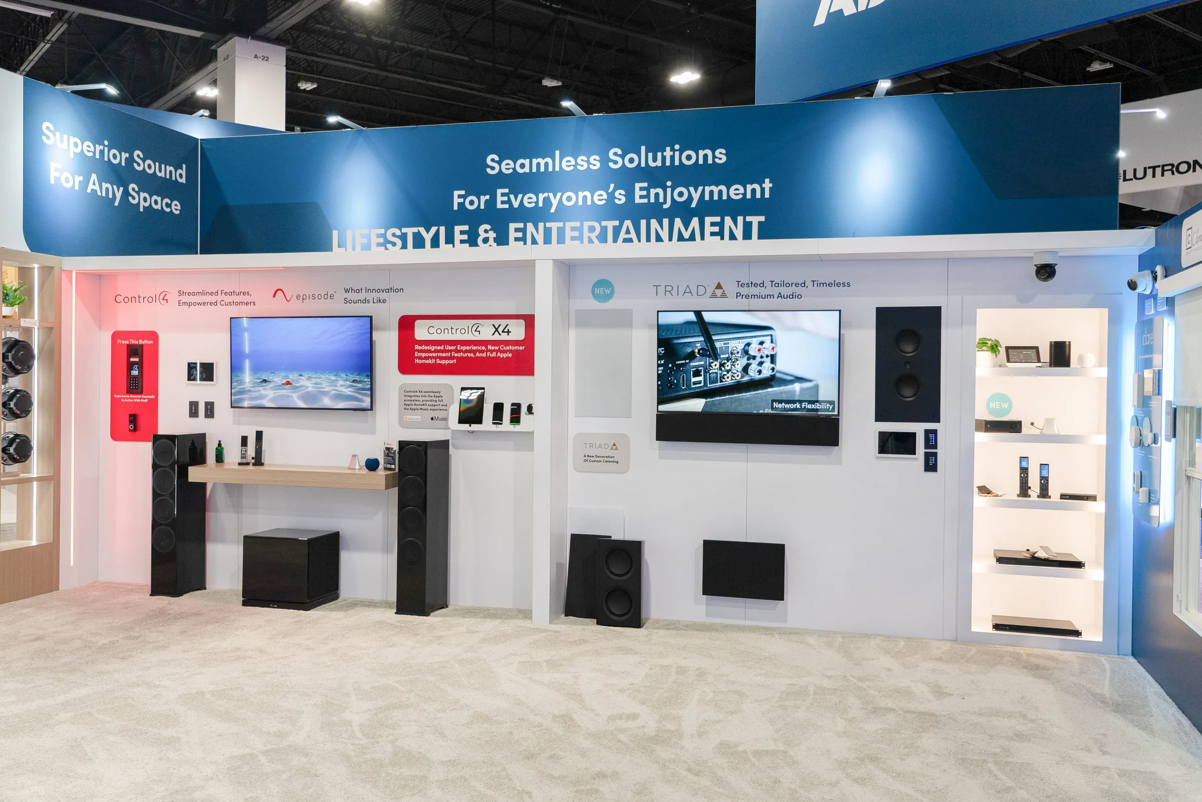 "Lifestyle and Entertainment" wall with TVs, speakers, and keypads