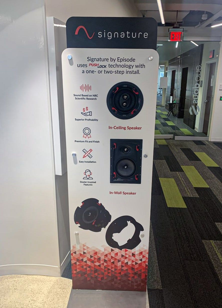 Finished Episode Signature speaker display standing in an office hallway