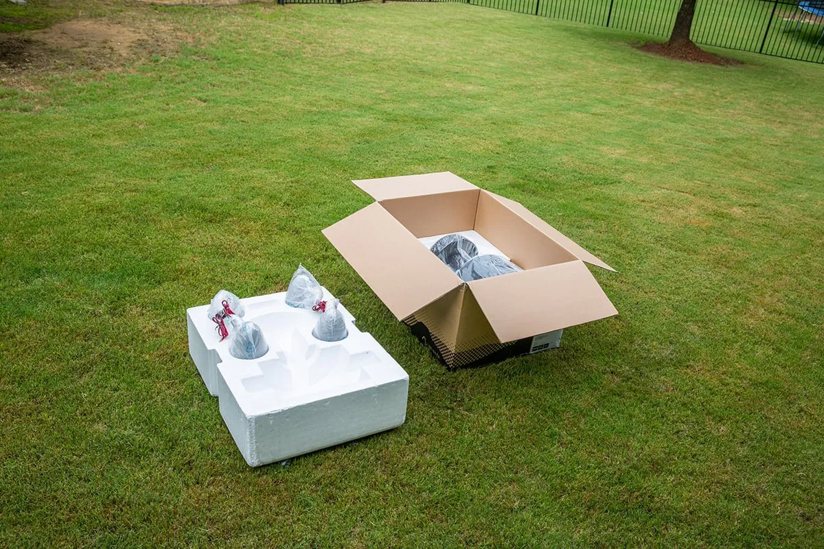 Episode Terrain box open on a lawn, showing the foam inserts and speakers