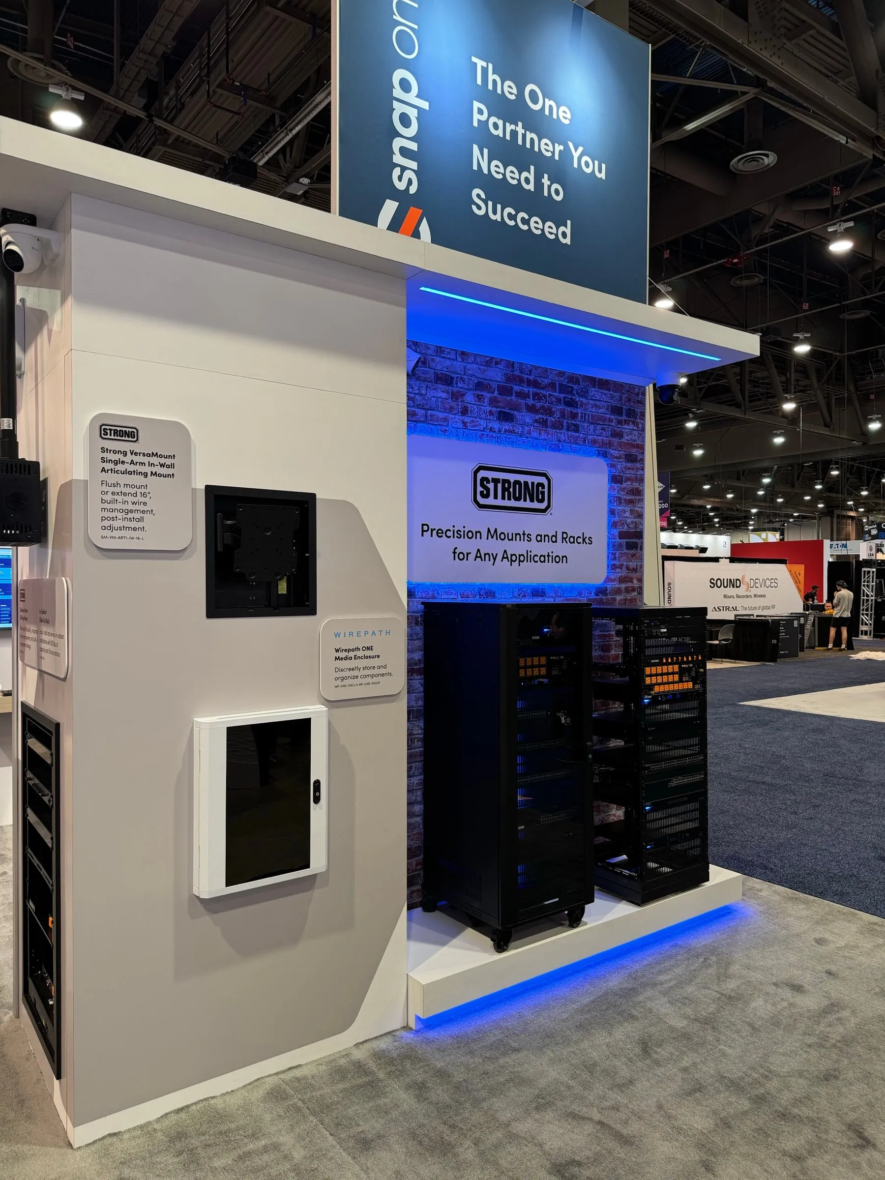 Narrow booth tower with a rack and wall panel