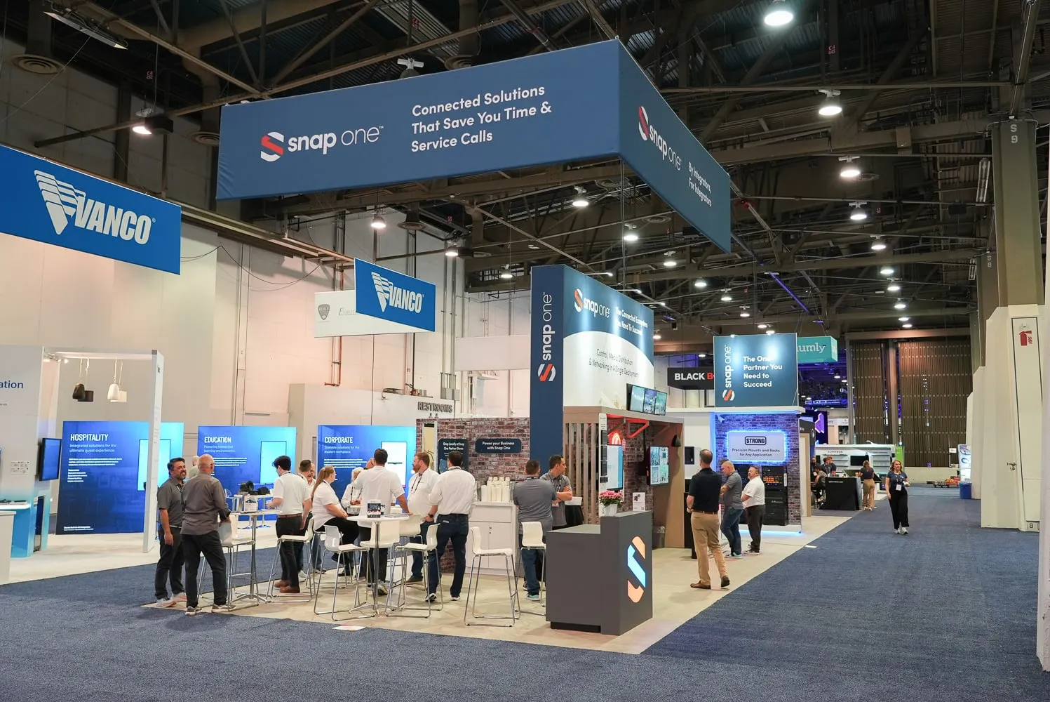 Wide view of the booth with Vanco and Snap One headers