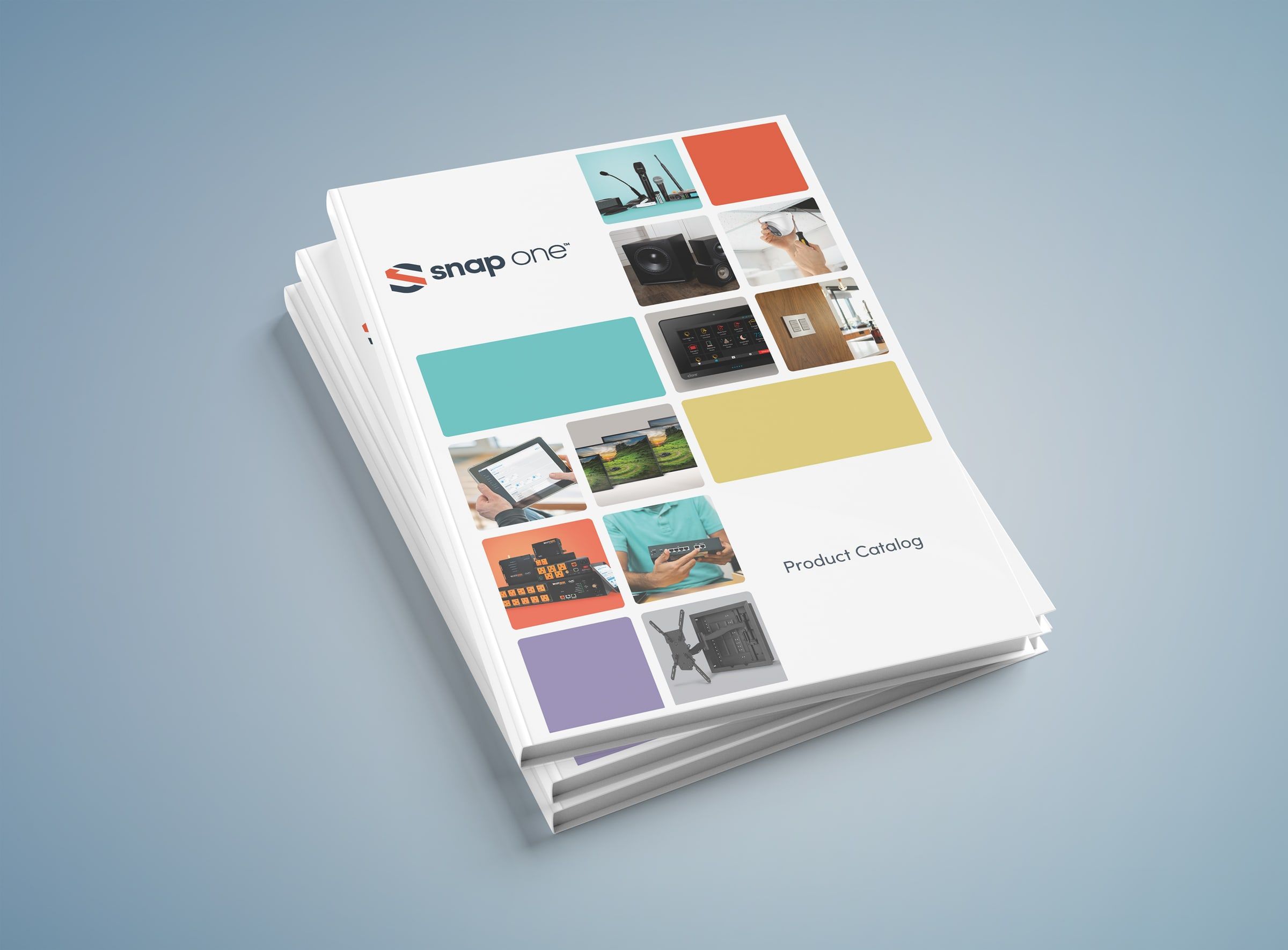Snap One 2022 product catalog, stacked copies on a blue background